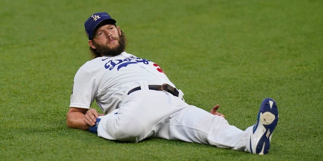 Los Angeles Dodgers starting pitcher Clayton Kershaw warms up before Game 1 of the baseball World Series against the Tampa Bay Rays Tuesday, Oct. 20, 2020, in Arlington, Texas.
