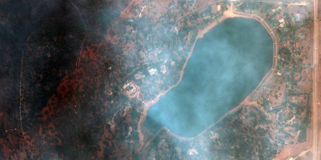 This satellite image provided by Maxar Technologies shows a natural color photo of the Lake of the Pines neighborhood and Allens Lake, Tuesday, Oct. 20, 2020, after the CalWood Fire burned through the area, west of Longmont, Colo., in Boulder County.