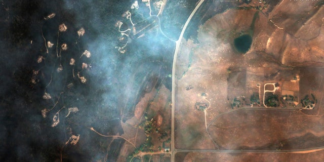 This satellite image provided by Maxar Technologies shows a natural color photo of Mountain Ridge Road and Foothills Ranch Drive, Tuesday, Oct. 20, 2020, after the CalWood Fire burned through the area, west of Longmont, Colo., in Boulder County.