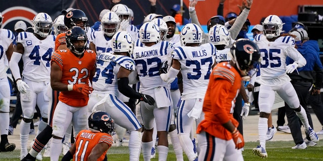 Indianapolis Colts' Julian Blackmon (32) celebrates with teammates after an interception during the second half of an NFL football game against the Chicago Bears, Sunday, Oct. 4, 2020, in Chicago. (AP Photo/Nam Y. Huh)