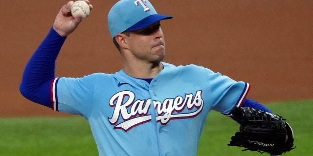 Texas Rangers starting pitcher Corey Kluber pitches against the Colorado Rockies in the first inning of a baseball game in Arlington, Texas, July 26, 2020. (Associated Press)