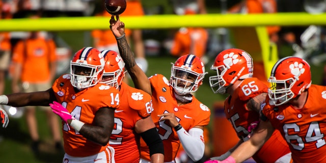 Wing-back Clemson DJ Uiagalelei (5) makes a pass during the NCAA college football match against Syracuse in Clemson, SC, on Saturday, October 24, 2020. (Ken Ruinard / Pool Photo via AP)