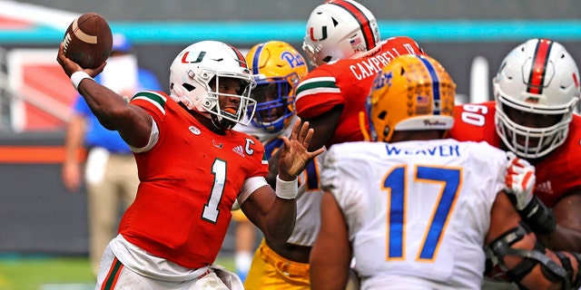 Miami quarterback D'Eriq King (1) passes against Pitts in the second half of an NCAA college football game in Miami Gardens, Fla., Saturday, Oct. 17, 2020. (Al Diaz/Miami Herald via AP)