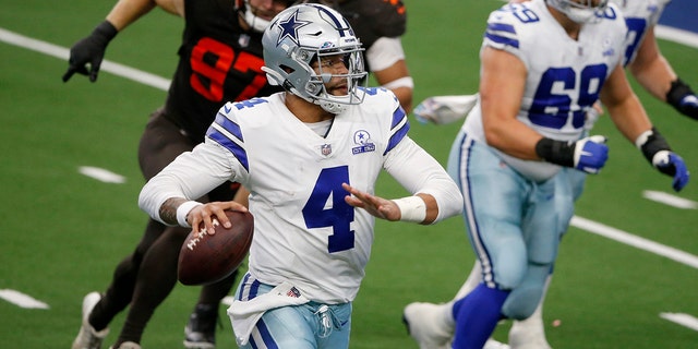 Dallas Cowboys quarterback Dak Prescott (4) scrambles out of the pocket before throwing a pass in the second half of an NFL football game against the Cleveland Browns in Arlington, Texas, Sunday, Oct. 4, 2020. (AP Photo/Michael Ainsworth)