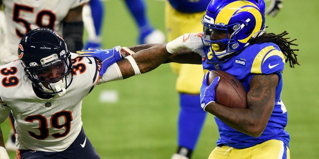 Los Angeles Rams running back Darrell Henderson, right, tries to get around Chicago Bears defensive back Eddie Jackson (39) during the second half of an NFL football game Monday, Oct. 26, 2020, in Inglewood, Calif. (AP Photo/Kelvin Kuo)