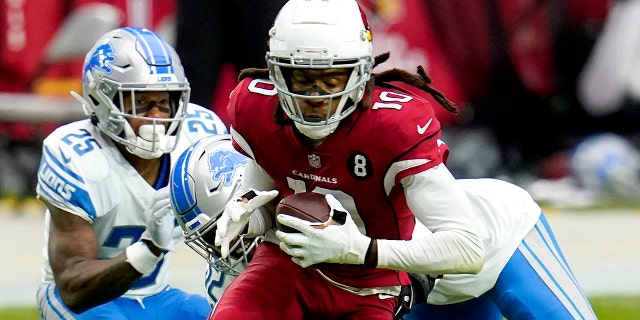 Arizona Cardinals wide receiver DeAndre Hopkins (10) is hit by Detroit Lions outside linebacker Christian Jones during the first half of an NFL football game, Sunday, Sept. 27, 2020, in Glendale, Ariz. (AP Photo/Ross D. Franklin)