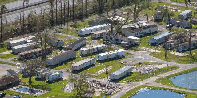 A devastated trailer park is seen in the aftermath of Hurricane Delta, Saturday Oct. 10, 2020, in Iowa, La.