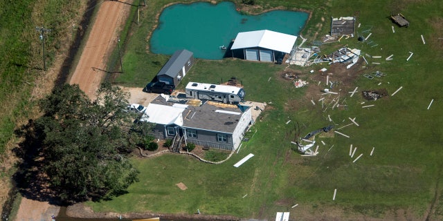 A debris field, fallen tree, and structure damage are seen in the aftermath of Hurricane Delta Saturday Oct. 10, 2020, in Gueydan, La.