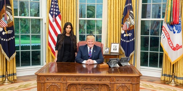 Kim Kardashian said she was warned that working with President Donald Trump could damage her reputation.