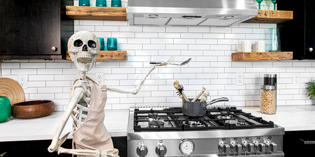A real estate agent with a funny bone is celebrating the spooky season by decorating homes with skeleton décor.