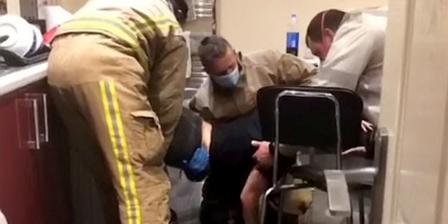 The fire department sent three firefighters to help free Cole, 21, from the dryer.