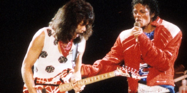 Guitarist Eddie Van Halen joins pop star Michael Jackson on stage to perform his hit song "Beat It" during The Jacksons Victory Tour on July 14, 1984 at Texas Stadium in Dallas. (Getty Images)