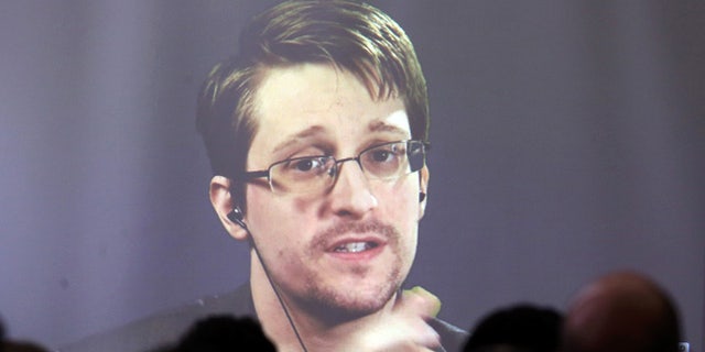 Edward Snowden speaks via video link during a conference at University of Buenos Aires Law School, Argentina.