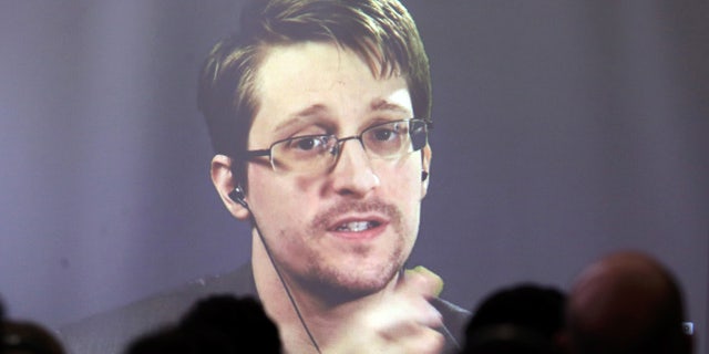 Edward Snowden speaks via video link during a conference at University of Buenos Aires Law School, Argentina.