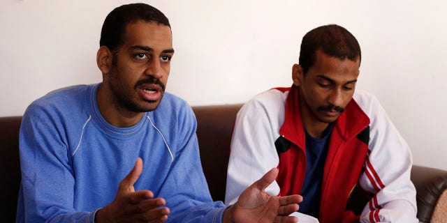 FILE - In this March 30, 2019, file photo, Alexanda Amon Kotey, left, and El Shafee Elsheikh, who were allegedly among four British jihadis who made up a brutal Islamic State cell dubbed "The Beatles," speak during an interview with The Associated Press at a security center in Kobani, Syria. (AP Photo/Hussein Malla, File)