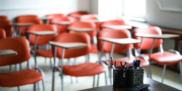 Chairs fill an empty classroom.