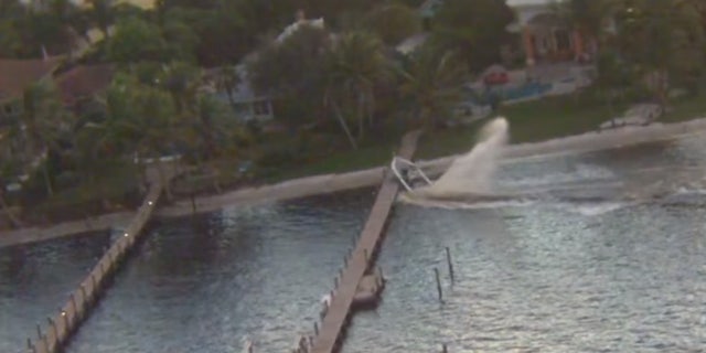 The out-of-control boat made a crash landing after going airborne over a dock in Stuart, Fla. on Friday.
