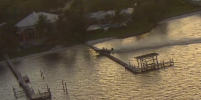 The out-of-control boat made a crash landing after going airborne over a dock in Stuart, Fla. on Friday.