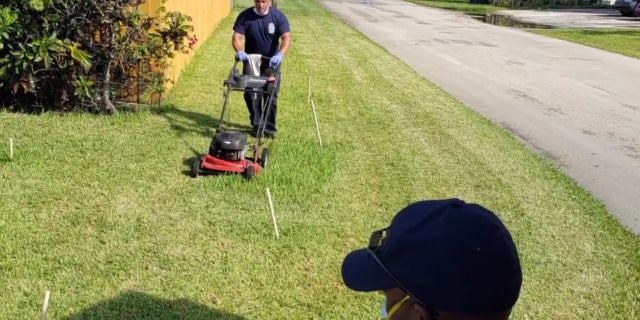 First responders from Fort Lauderdale Fire Rescue cut Prince Pinkney's grass after he was treated for heat exhaustion.