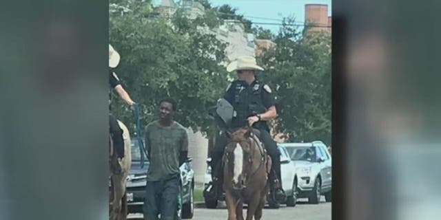 Donald Neely, 44, was arrested for criminal trespassing in August 2019 before two mounted Galveston police officers handcuffed him and led him by rope down several city blocks. (Handout) 