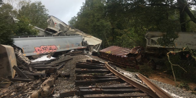 Georgia train derailment sparks fire after Delta unleashes flash flooding, tornadoes across South 1 A freight train derailed early Sunday in Lilburn, Ga., sparking a small fire and triggering evacuations in one neighborhood.