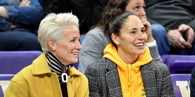 USWNT forward Megan Rapinoe, left, and Seattle Storm guard Sue Bird enjoy a game at the Alaska Airlines Arena on January 27, 2019 in Seattle, Washington. (Getty Images)