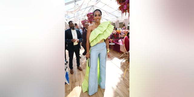 Kelly Rowland says she was hesitant to announce pregnancy amid a tough year for herself and fans across the U.S.