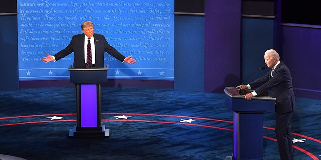 U.S. President Donald Trump, center, speaks as Joe Biden, 2020 Democratic presidential nominee, right, listens during the first U.S. presidential debate hosted by Case Western Reserve University and the Cleveland Clinic in Cleveland, Ohio, U.S., on Tuesday, Sept. 29, 2020. Trump and Biden kick off their first debate with contentious topics like the Supreme Court and the coronavirus pandemic suddenly joined by yet another potentially explosive question -- whether the president ducked paying his taxes. Photographer: Kevin Dietsch/UPI/Bloomberg via Getty Images