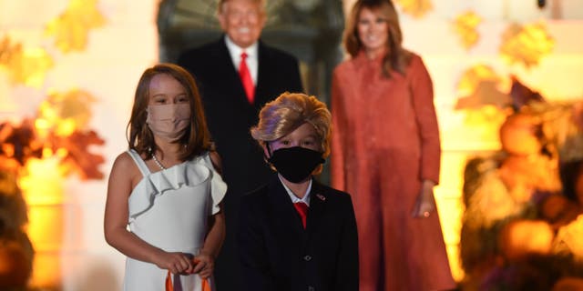 The president is said to have been “particularly pleased” with two youngsters dressed as the first couple, pictured. (Olivier Douliery/AFP via Getty Images)