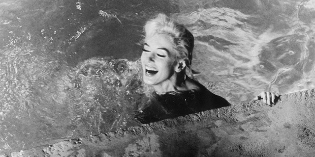 Marilyn Monroe, playing Ellen Arden, swims naked in 1962's 'Something's Got to Give.' The movie was never completed due to Monroe's sudden death during production.