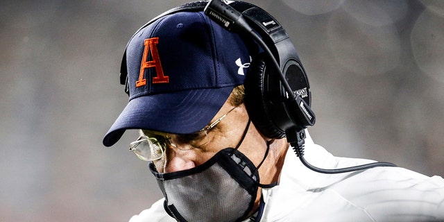 Auburn coach Gus Malzahn walks the sideline during the second half of the team's NCAA college football game against Arkansas on Saturday, Oct. 10, 2020, in Auburn, Ala. (AP Photo/Butch Dill)