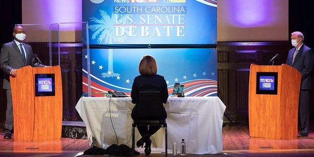 Democratic challenger Jaime Harrison, left, and U.S. Sen. Lindsey Graham, right, R-S.C., face off in the South Carolina U.S. Senate debate at Allen University in Columbia, S.C., Saturday, Oct. 3, 2020. (Associated Press)