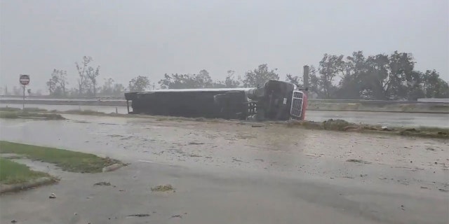 A truck flipped on its side due to winds from Hurricane Delta is seen at Lake Charles, Louisiana, U.S., October 9, 2020, in this still image from video obtained via social media. Adam Fields via REUTERS ATTENTION EDITORS - THIS IMAGE HAS BEEN SUPPLIED BY A THIRD PARTY. MANDATORY CREDIT. NO RESALES. NO ARCHIVES. - RC2DFJ9PHEVJ