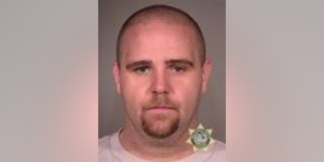 Jeffrey Richard Singer, 33, faces federal charges in connection with the alleged theft of an American flag and injury to a police officer during protests in Portland.