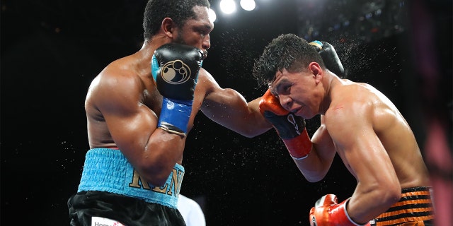 Tureano Johnson (大号) exchanges punches with Jaime Munguia ([R) at Fantasy Springs Casino on October 30, 2020, in Indio, 加利福尼亚州. (Photo By Tom Hogan/Golden Boy/Getty Images)