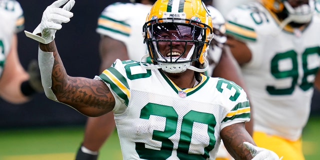 Green Bay Packers running back Jamaal Williams (30) warms up before an NFL football game against the Houston Texans, Sunday, Oct. 25, 2020, in Houston. (AP Photo/Sam Craft)