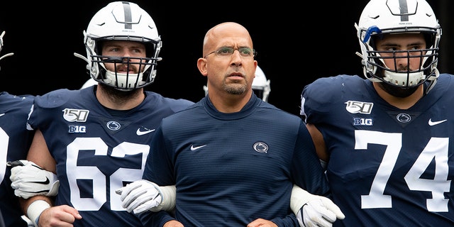 FILE - In this Saturday, Sept. 14, 2019 file photo, Penn State head coach James Franklin leads his team onto the field for an NCAA college football game against Pittsburgh in State College, Pa. (AP Photo/Barry Reeger, File)