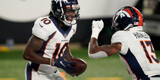 Denver Broncos wide receiver Jerry Jeudy (10) celebrates with K.J. Hamler (13) after scoring a touchdown during the first half of the team's NFL football game against the New York Jets on Thursday, Oct. 1, 2020, in East Rutherford, N.J. (AP Photo/Seth Wenig)