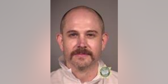 John B Russell, 41, is facing multiple charges following the incident.