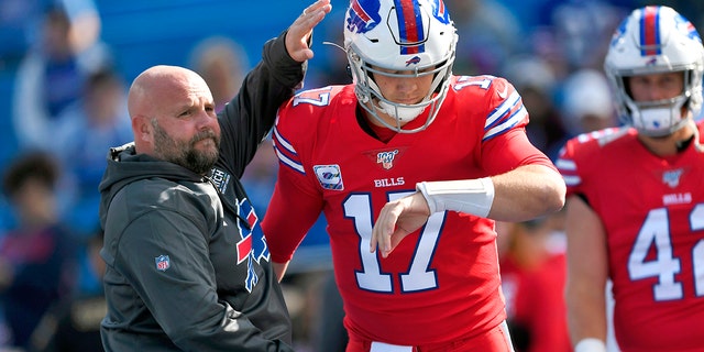 Buffalo Bills offensive coordinator Brian Daboll, left, encourages quarterback Josh Allen as he warms up before an NFL football game Miami Dolphins, Sunday, Oct. 20, 2019, in Orchard Park, N.Y. (AP Photo/Adrian Kraus, File)