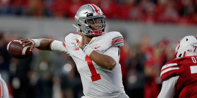 FILE - In this Saturday, Sept. 28, 2019, file photo, Ohio State quarterback Justin Fields (1) throws a pass during the first half of an NCAA college football game against Nebraska in Lincoln, Neb. Ohio State hosts Nebraska on Saturday, Oct. 24, 2020. (AP Photo/Nati Harnik, File)