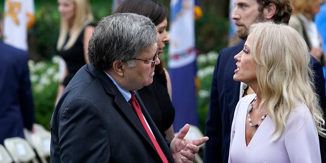 Attorney General William Barr speaks with Kellyanne Conway after President Donald Trump announced Judge Amy Coney Barrett as his nominee to the Supreme Court, in the Rose Garden at the White House, Saturday, Sept. 26, 2020, in Washington. (AP Photo/Alex Brandon)