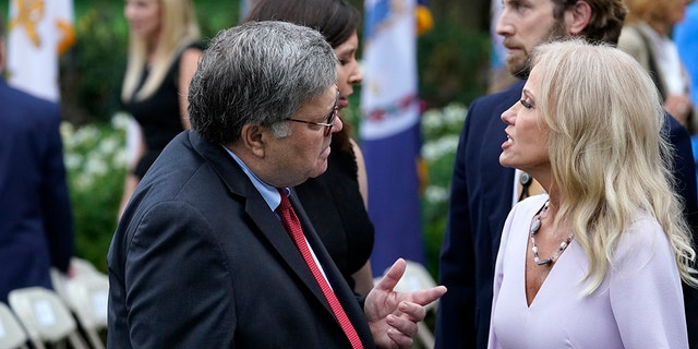 Attorney General William Barr speaks with Kellyanne Conway after President Donald Trump announced Judge Amy Coney Barrett as his nominee to the Supreme Court, in the Rose Garden at the White House, Saturday, Sept. 26, 2020, in Washington. (AP Photo/Alex Brandon)