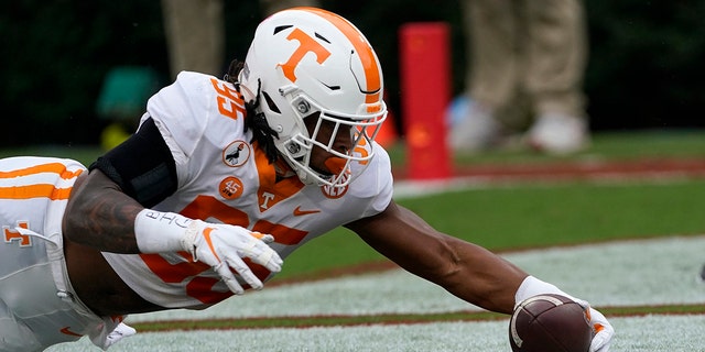 Tennessee linebacker Kivon Bennett (95) recovers a Georgia fumble in the end zone for a touchdown in the first half of an NCAA college football game Saturday, Oct. 10, 2020, in Athens, Ga. (AP Photo/John Bazemore)