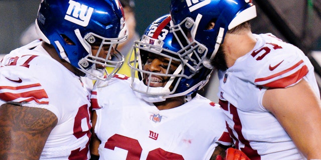 New York Giants' Logan Ryan (23) celebrates with teammates after the Giants forced a turnover on downs during the second half of an NFL football game against the Philadelphia Eagles, Thursday, Oct. 22, 2020, in Philadelphia.