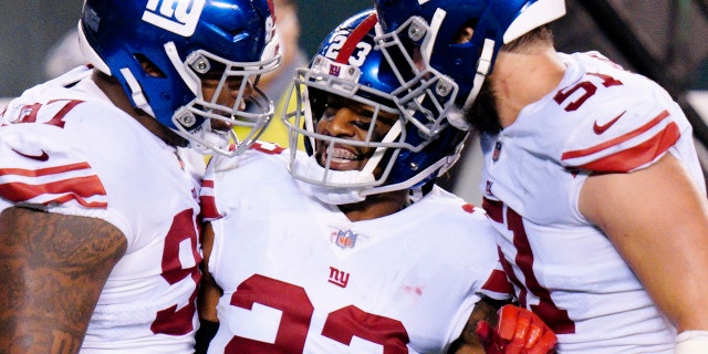 New York Giants' Logan Ryan (23) celebrates with teammates after the Giants forced a turnover on downs during the second half of an NFL football game against the Philadelphia Eagles, Thursday, Oct. 22, 2020, in Philadelphia.