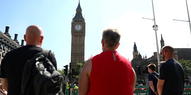 Members of the public observe a minute's silence following the Manchester Arena bombing, in Parliament Square in London, Britain, May 25, 2017.