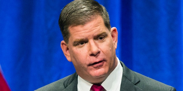 In this file photo from Jan. 1, 2018, Boston Mayor Marty Walsh speaks at his second inauguration in Boston.  (Keith Bedford / The Boston Globe via AP, file)