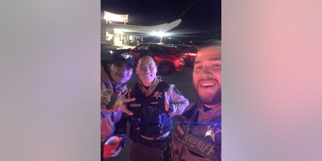 Marvin and two Oregon law enforcement officers who helped him safely get home, pictured.