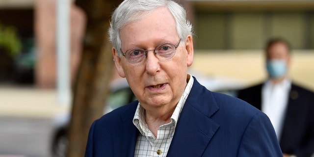 Senate Majority Leader Mitch McConnell, R-Ky., speaks to reporters after casting his vote in the 2020 general election at the Kentucky Exhibition Center in Louisville, Ky., Thursday, Oct. 15, 2020. (AP Photo/Timothy D. Easley)